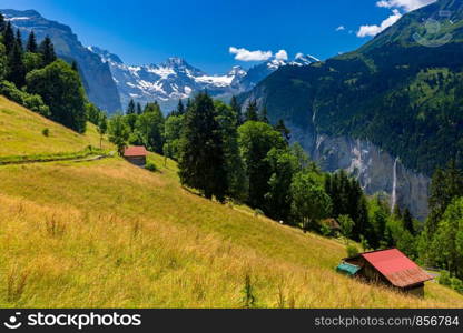 Wonderful mountain car-free village Wengen, Bernese Oberland, Switzerland. The Jungfrau is visible in the background. Mountain village Wengen, Switzerland