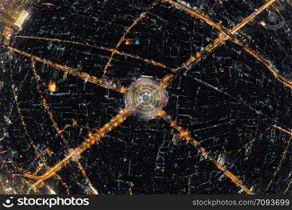 Wongwian Yai roundabout. Aerial view of highway junctions. Roads shape circle in structure of architecture and technology transportation concept. Top view. Urban city, Bangkok at night, Thailand.