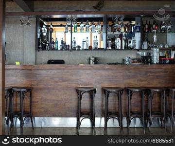 wood alcoholic bar interior with chairs