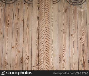 wood background with fragments of carving in the center