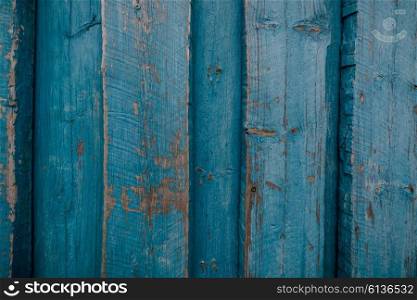 Wood background with worn blue painted planks