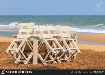 wood bench with sea in the background