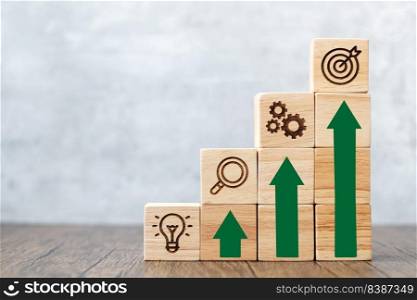 wood block stack of building with rise graph. business growth, goal, strategy, target, mission, action, success, teamwork, research and idea concept