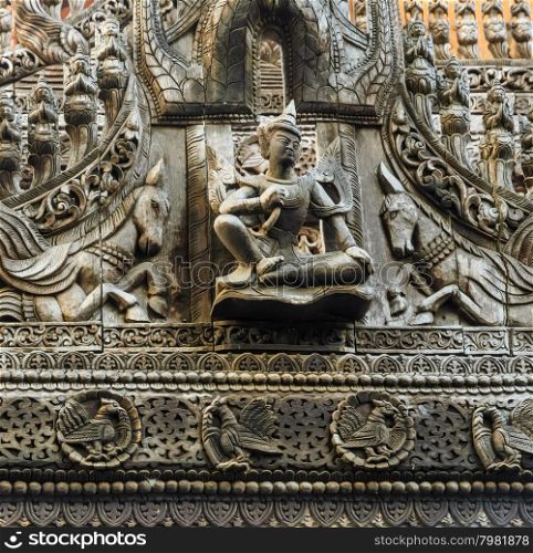 Wood carving of Lawka Nat at Shwenandaw Monastery in Mandalay, Myanmar