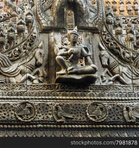 Wood carving of Lawka Nat at Shwenandaw Monastery in Mandalay, Myanmar
