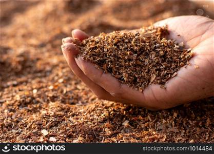 Wood chips or sawdust obtained from the manufacturing industry.