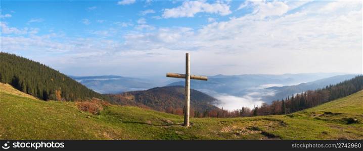 Wood cross on fall mountain plateau. Four shots composite picture. Jaremche-Town outskirts, Ivano-Frankivsk Region, Ukraine.