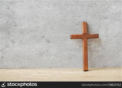 wood cross on table background, pray for blessings from God. Christian Religion, Crucifix and Faith concept