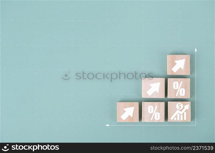 Wood cube block stacking as step stair with arrow up and percent symbol icon , concept of financial for business growth success process