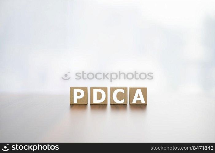 Wood cube PDCA concept Plan do check Act for business plan development, ACTION PLAN Strategy