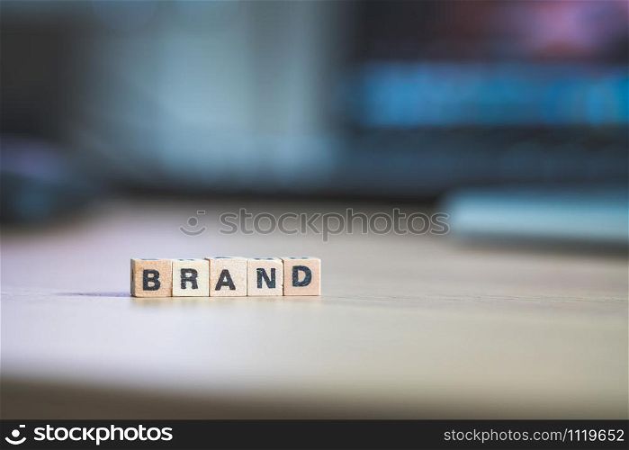 Wood cubes with the word ?Brand?, close up picture with copy space. Identity, Marketing, Business. Text space.