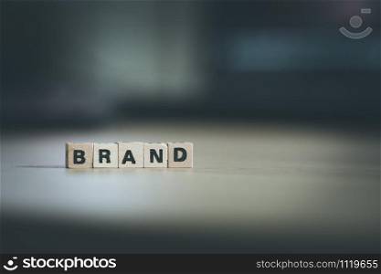 Wood cubes with the word ?Brand?, close up picture with copy space. Identity, Marketing, Business. Text space.