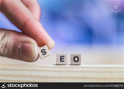Wood cubes with the word ?SEO?, close up picture with copy space. Search engine optimization.