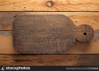 Wood cutting board at wooden background top table