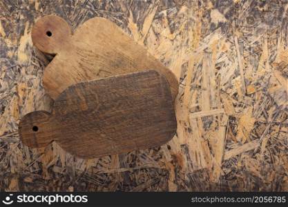 Wood cutting board at wooden osb background top table