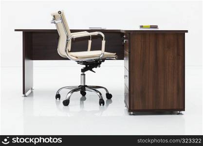 wood desk and chair on a white wall