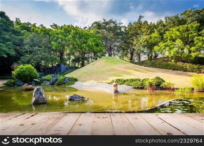 Wood floor on Pond and Water Landscape in Japanese Garden
