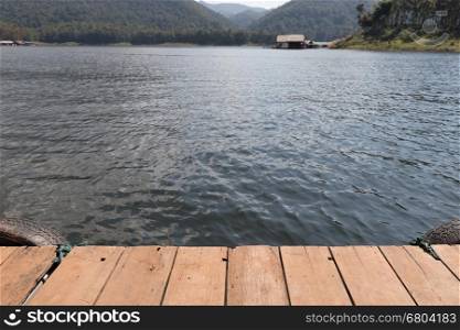 Wood Floor with Lake in the mountains, Mae Ngad Dam and Reservoir in Thailand