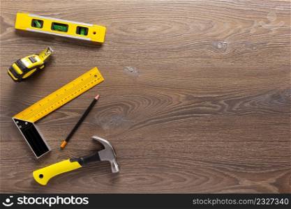 Wood laminate floor and tools background texture. Wooden laminate top view