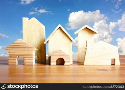 wood model home on brown plank bule sky white cloud shape nature background