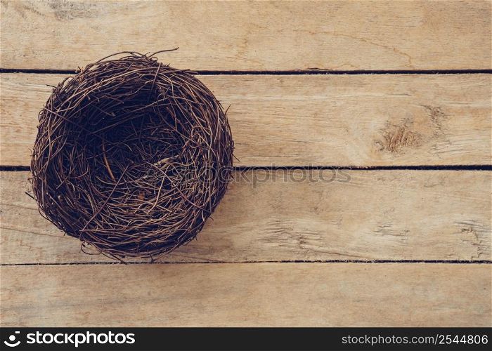 Wood nest on wooden background and texture with copy space.