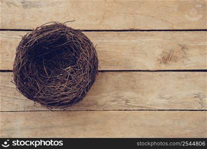 Wood nest on wooden background and texture with copy space.