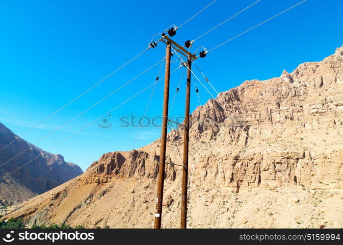 wood pylon energy and current line in oman the electric cable