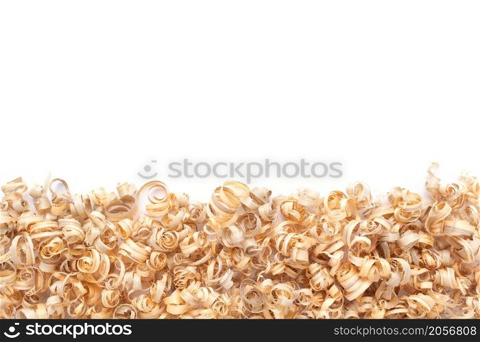 Wood shavings isolated on white background. Wooden shaving from old plank board texture