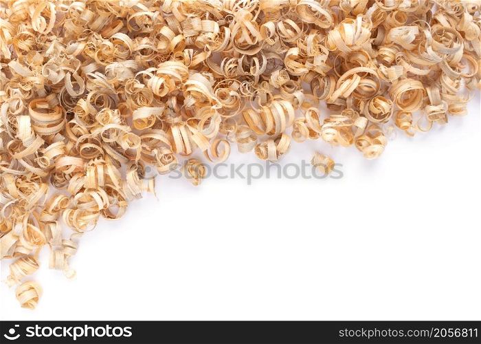 Wood shavings isolated on white background. Wooden shaving from old plank board texture