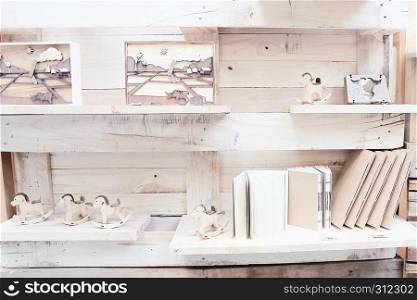 wood shelf with book and toys