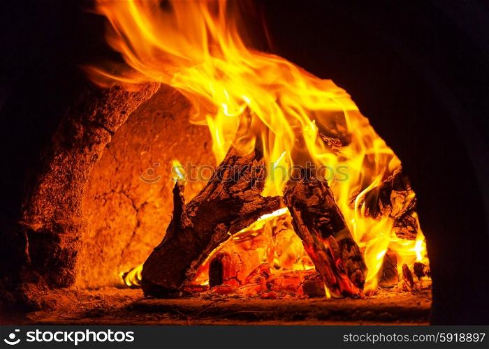 Wood stove with fire and blaze