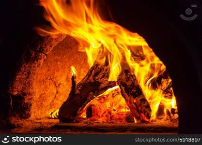 Wood stove with fire and blaze