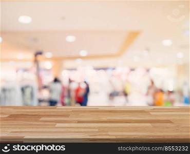 Wood table and shopping mall Blurred background with space for product.