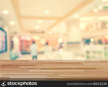 Wood table and shopping mall Blurred background with space for product.