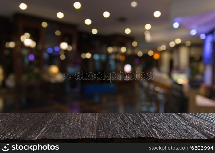 wood table for montage or display your product with blur background of pub bar restaurant