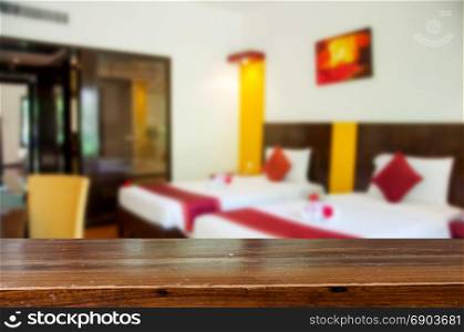Wood table top Abstract blur beautiful luxury bedroom interior for background for product display montage.