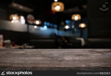 Wood Table Top in Blur Background room interior with empty copy space