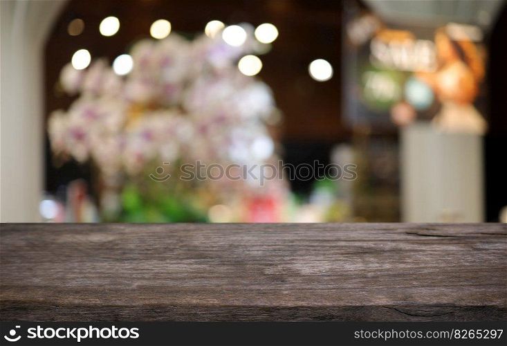 Wood table top in front of abstract blurred background. Empty wooden table space for text marketing promotion. blank wood table copy space for background