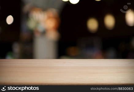 Wood table top in front of abstract blurred background. Empty wooden table space for text marketing promotion. blank wood table copy space for background