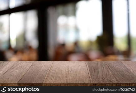 Wood table top in front of abstract blurred background. Empty wooden table space for text marketing promotion. blank wood table copy space for background