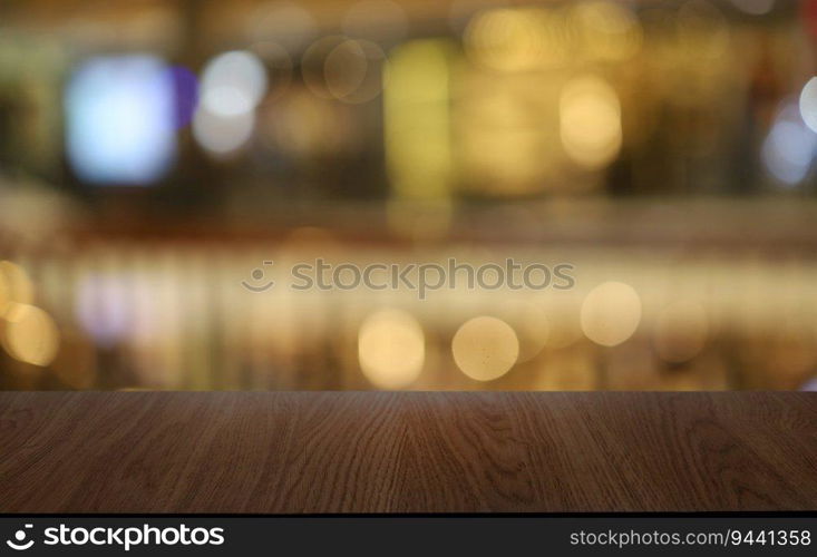 Wood table top in front of abstract blurred background. Empty wooden table space for text marketing promotion. blank wood table surface copy space for background.