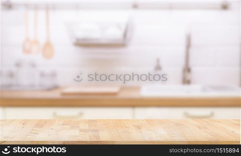 Wood table top on blur kitchen room background. can be used for display or montage your products