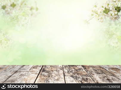 Wood table top on blur white green natural abstract background from tree branches