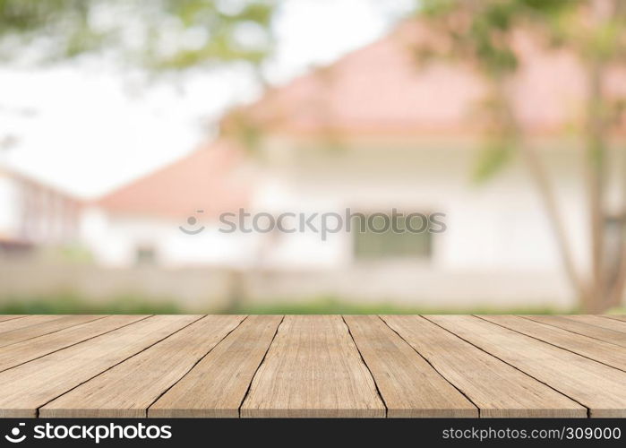 Wood table top on blurred background at garden,for montage your products