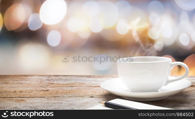 Wood table top on bokeh abstract background and used for montage or display products.