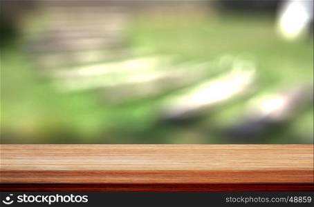 Wood table top on bokeh green background, for display your products