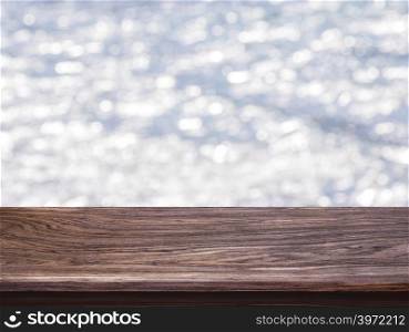 Wood table top on bokeh light gray background. For montage product display or design key visual layout
