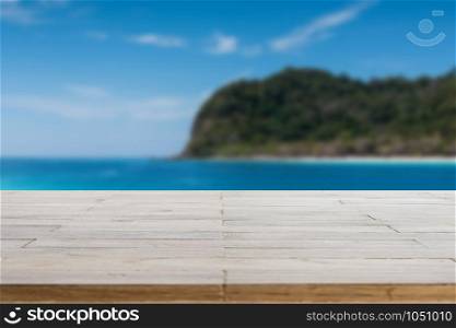 Wood table top or flooring on the beach background, can you use for display your products