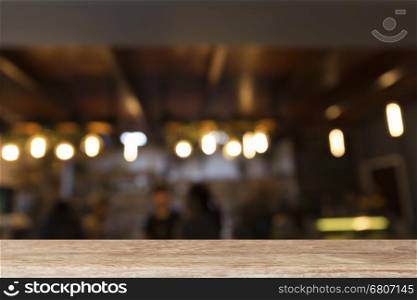 wood table with beverage counter at coffee shop restaurant (blur background)