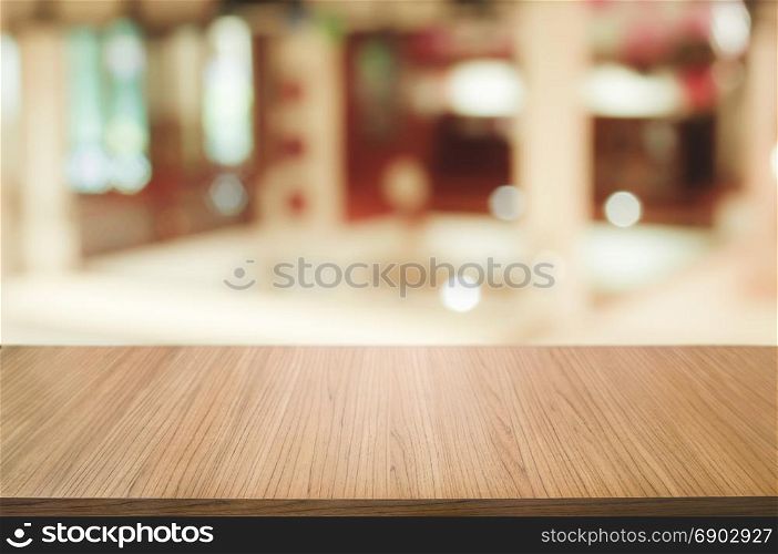 wood table with blurred restaurant background